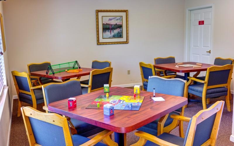 a room with tables and chairs