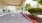 a street with a building and trees