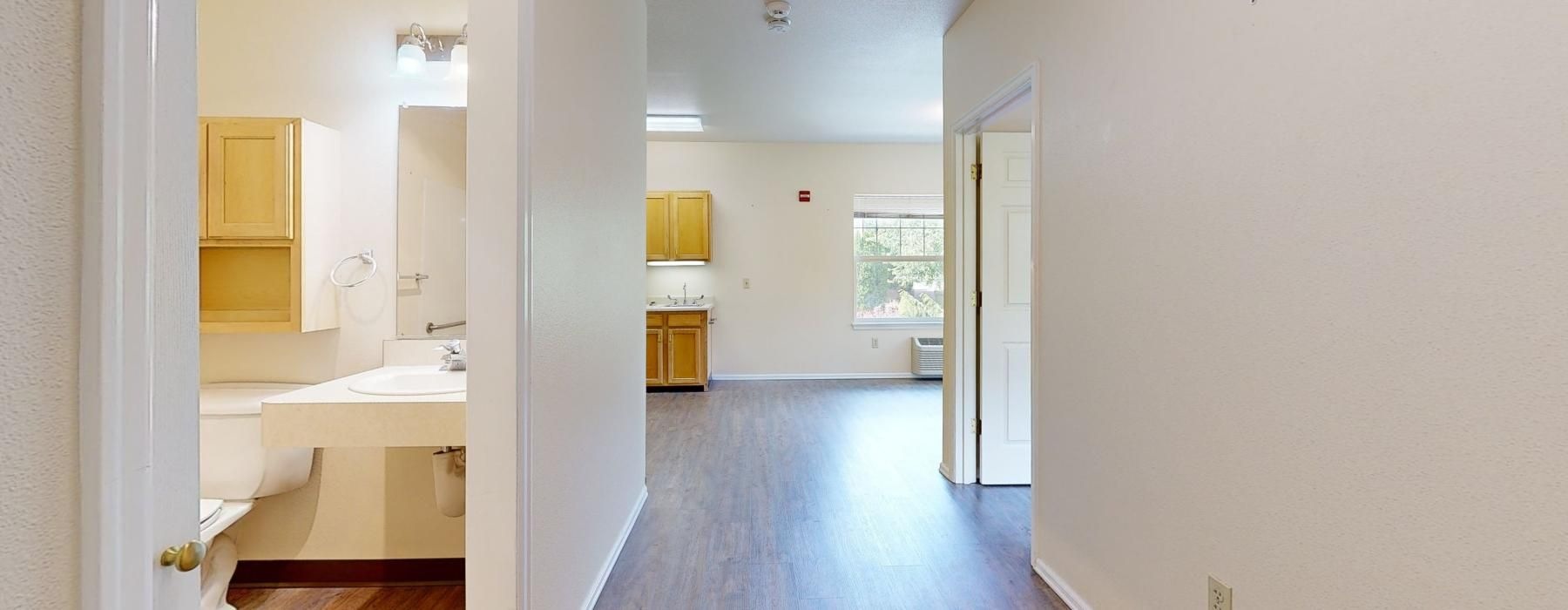 a bathroom with wooden floors